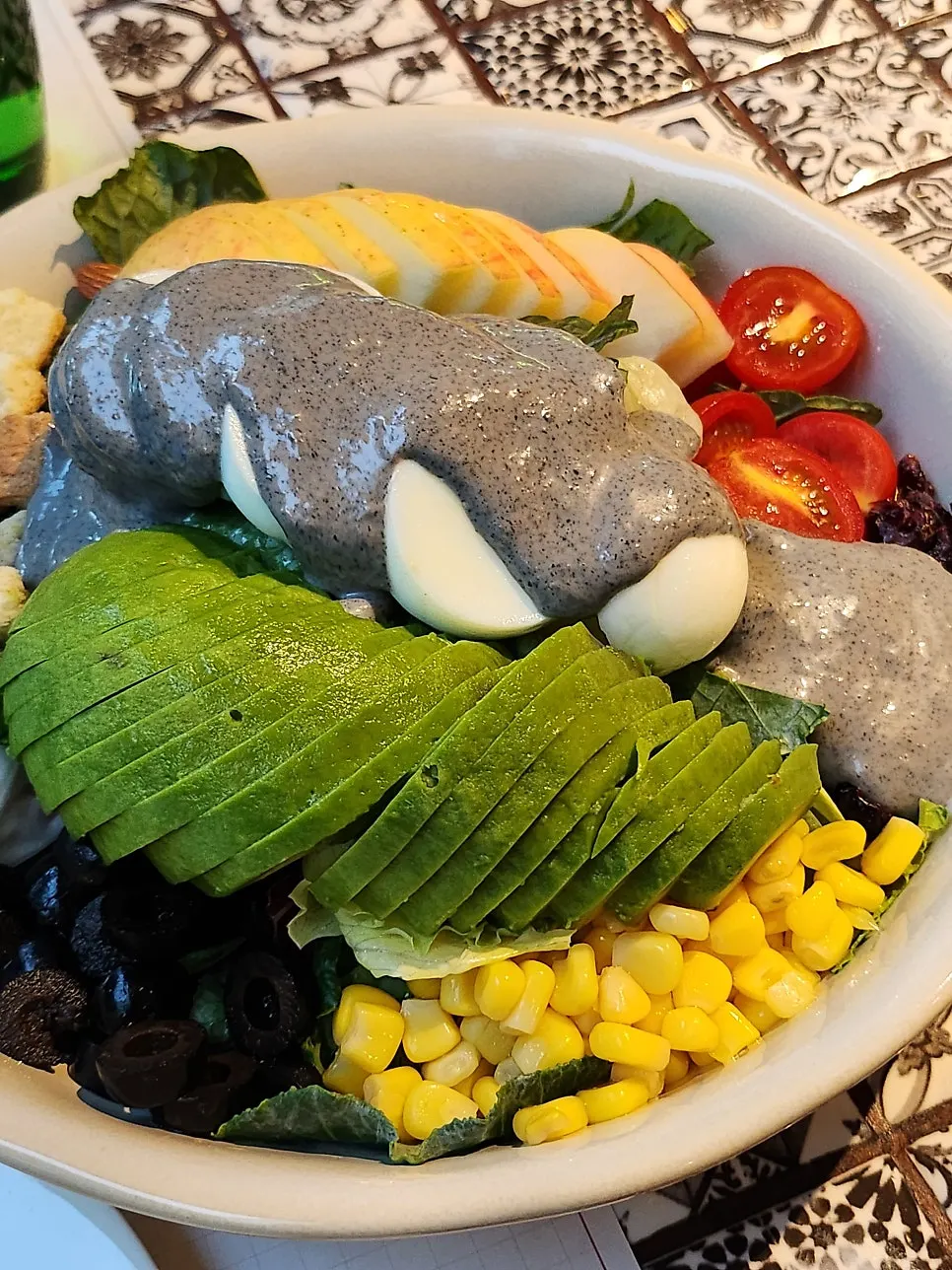 Cobb salad drizzled with black sesame dressing