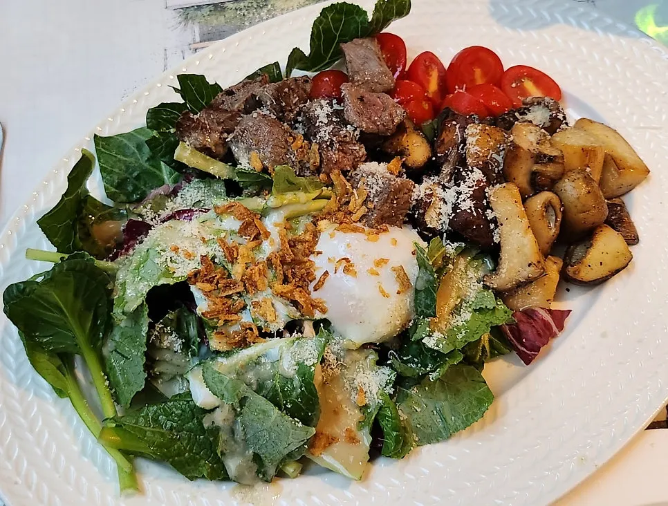 Casamil beef mushroom salad topped with poached egg