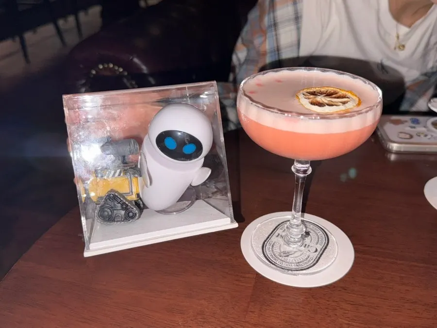 Pink Wall-E cocktail served with movie figurine props
