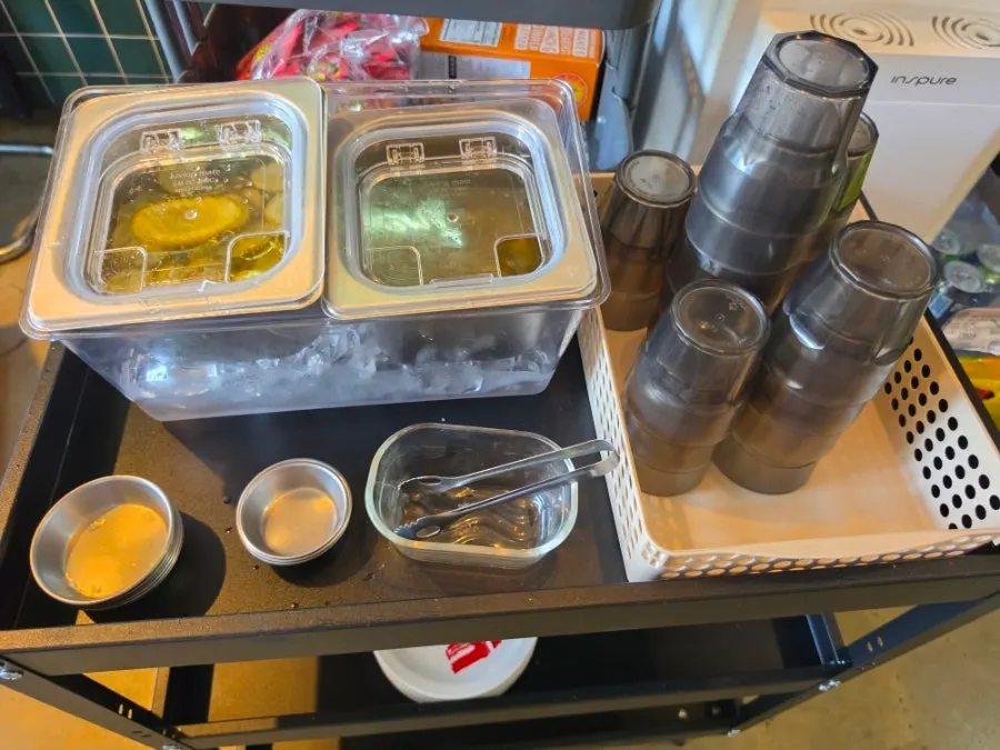 Pickles and sauces at the self-serve bar
