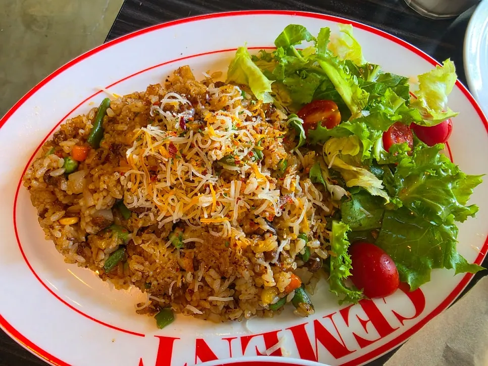 Spicy beef belly pilaf sprinkled with parmesan cheese