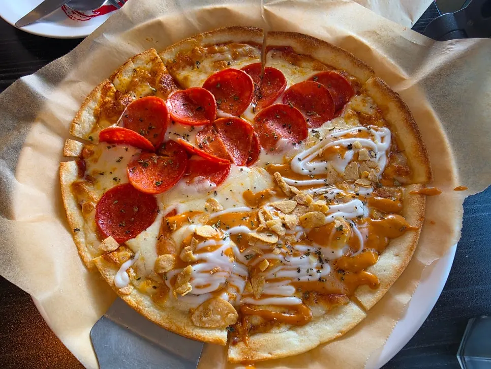 Half-and-half pizza with pepperoni and chipotle shrimp