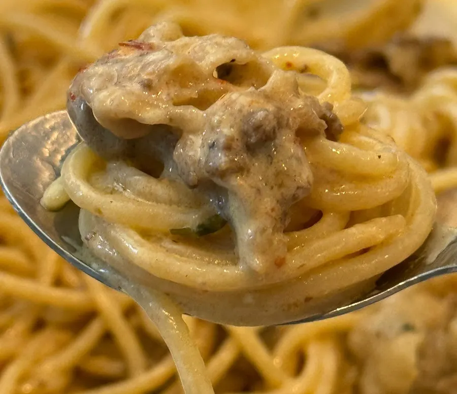 Pasta with thick cream sauce soaked in