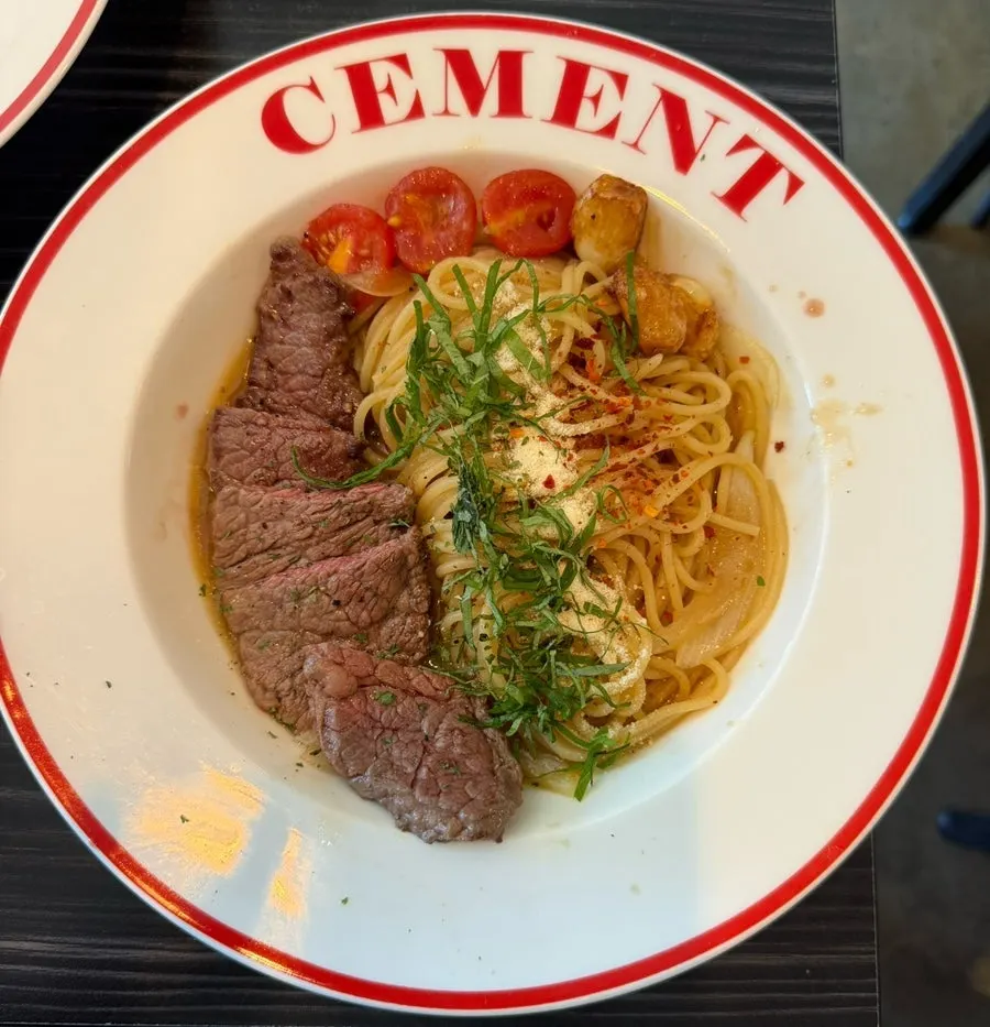 A plate of beef striploin oil pasta