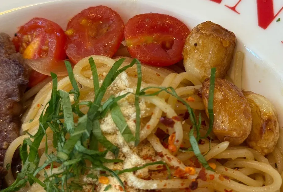 Grilled cherry tomato and garlic garnish