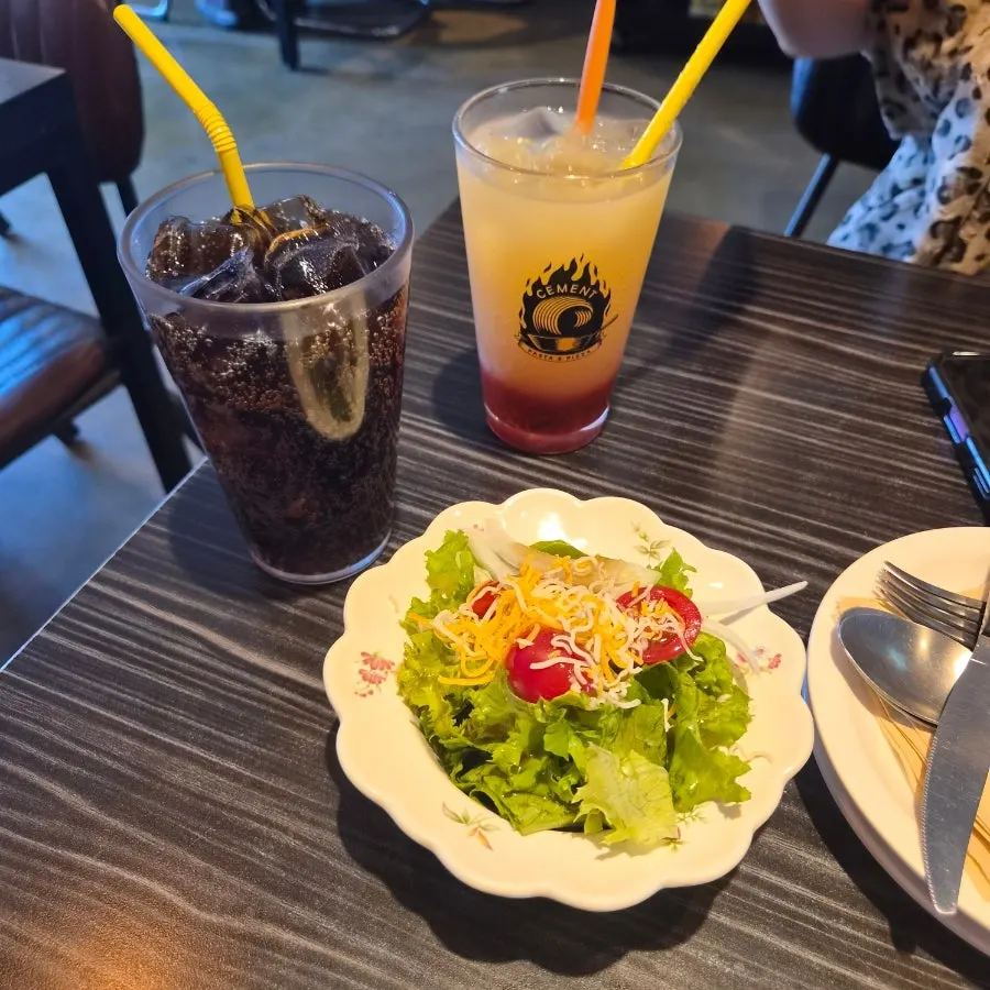 Ciment Mini Salad topped with cherry tomatoes
