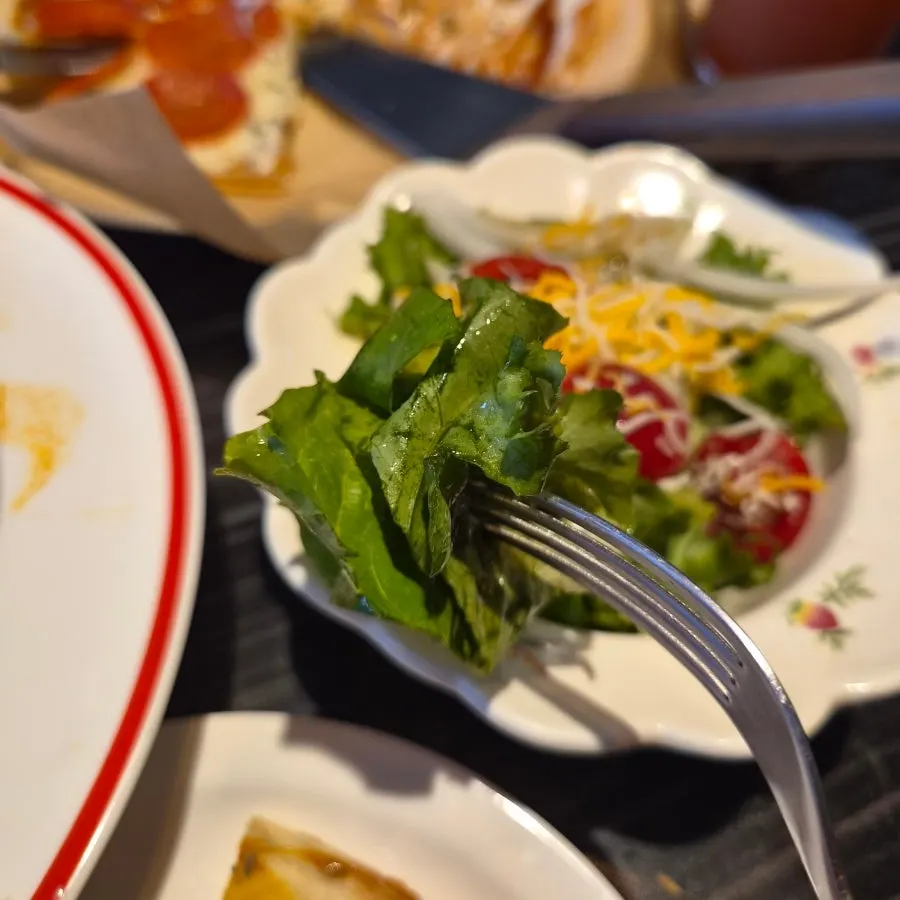 Serving the salad onto a plate