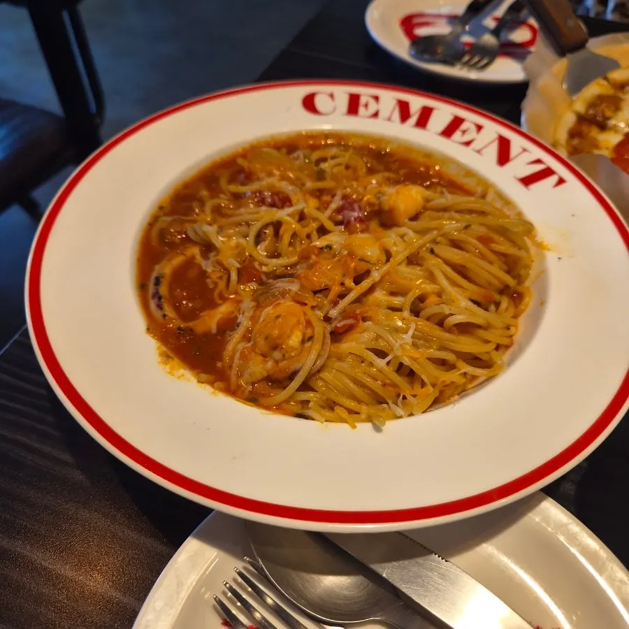 A plate of Ciment's spicy seafood tomato pasta