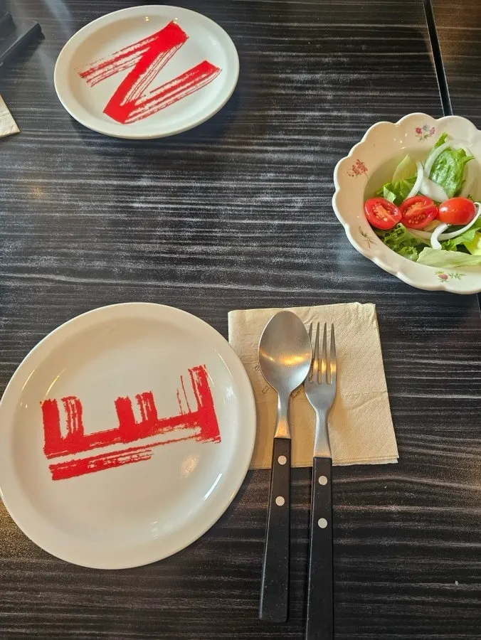 Table spread with Toowoomba shrimp pasta and half-and-half pizza