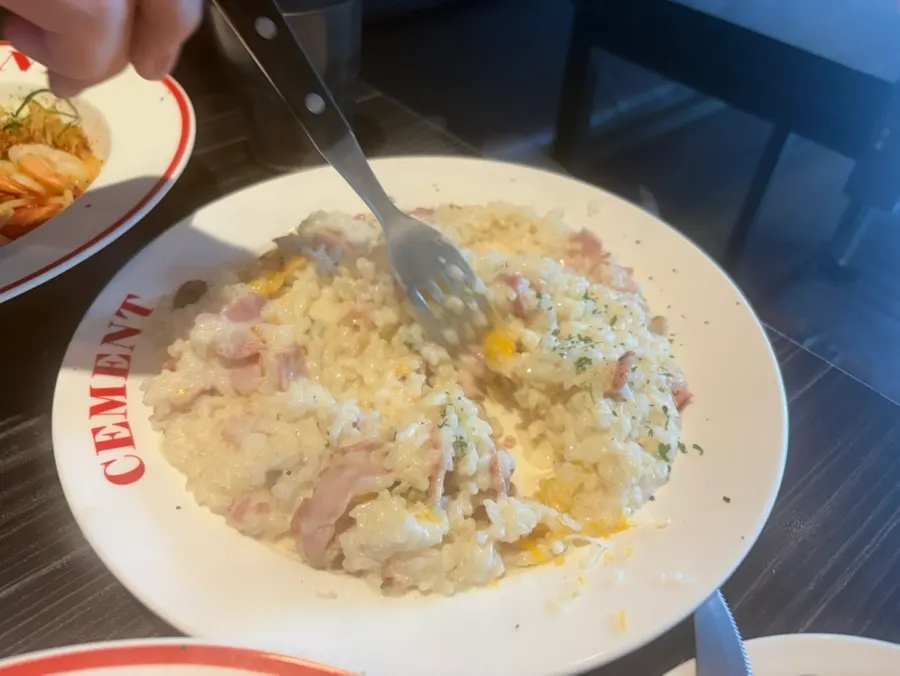 Table with pasta and risotto being shared