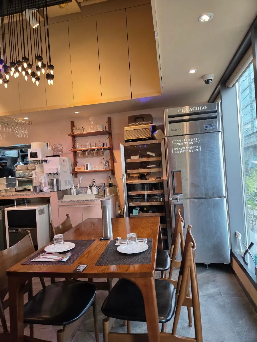 Interior centered around wooden tables