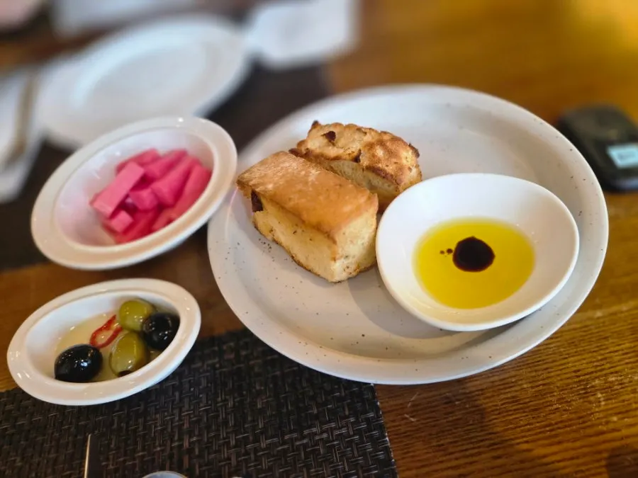 Pre-meal bread, olives, and olive oil