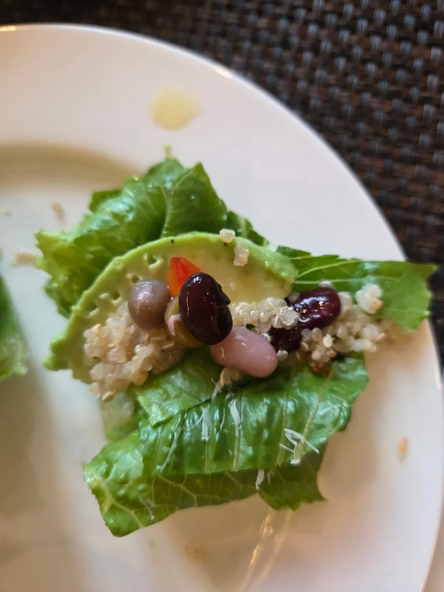 A forkful of avocado bean salad