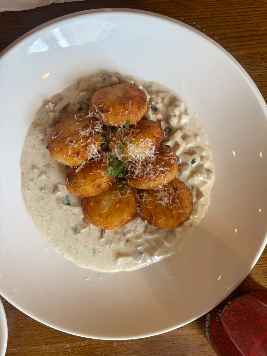 A plate of Cenacolo's signature potato gnocchi