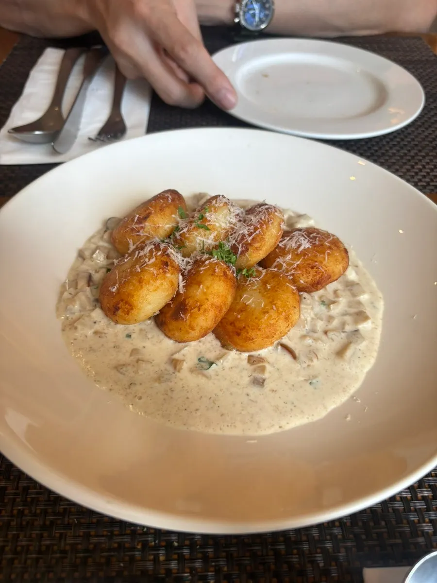 Close-up of the mushroom-studded gnocchi sauce