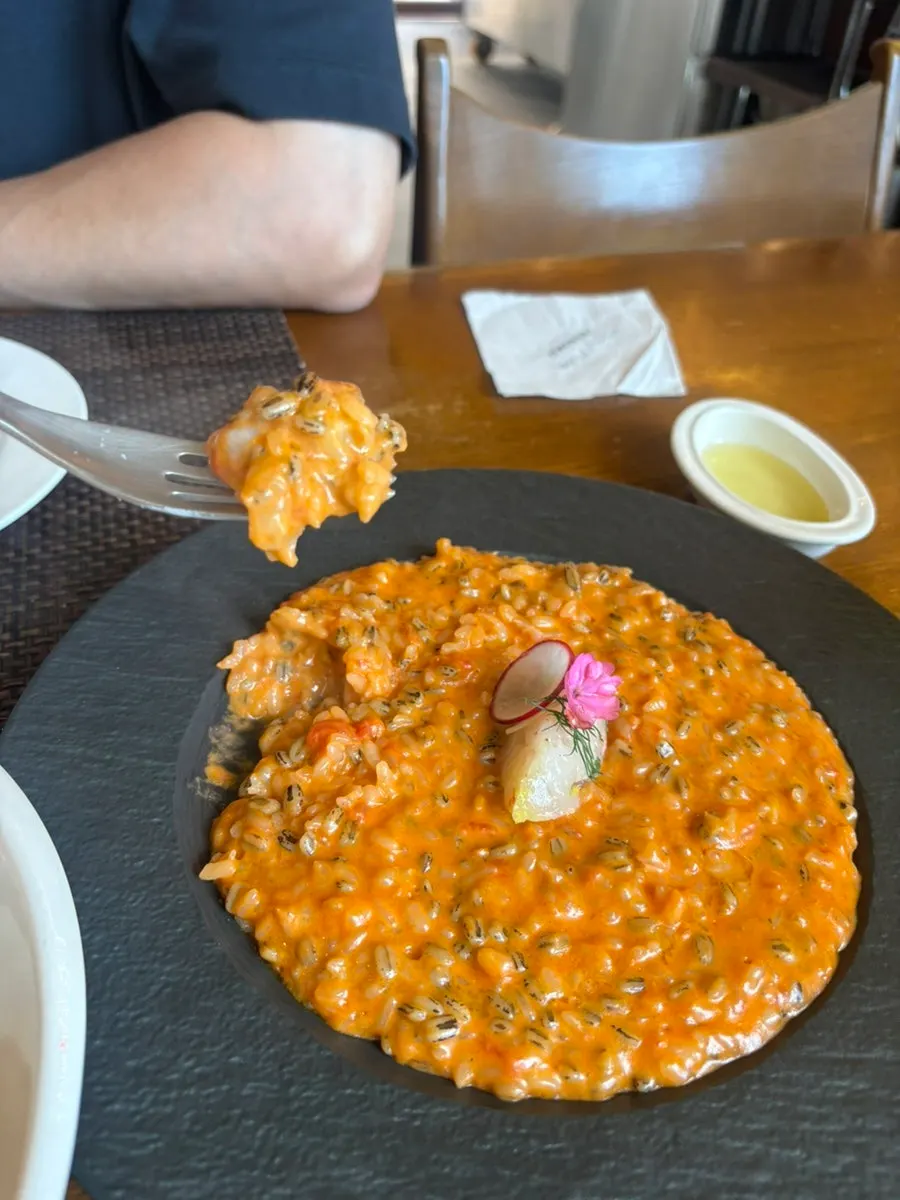 A forkful of potato gnocchi lifted from the plate