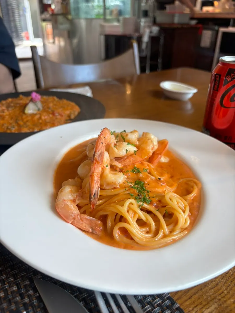 Shrimp rosé pasta topped with large shrimp