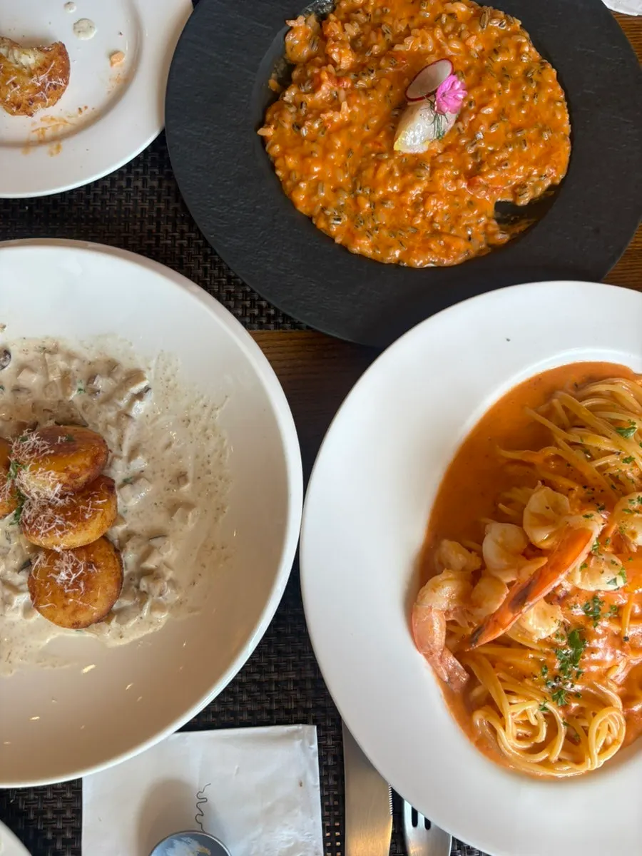 Table set with gnocchi, pasta, and risotto together