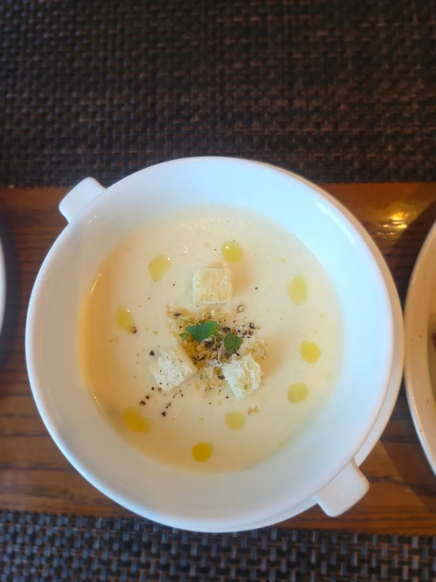 Soup of the day topped with croutons and herbs