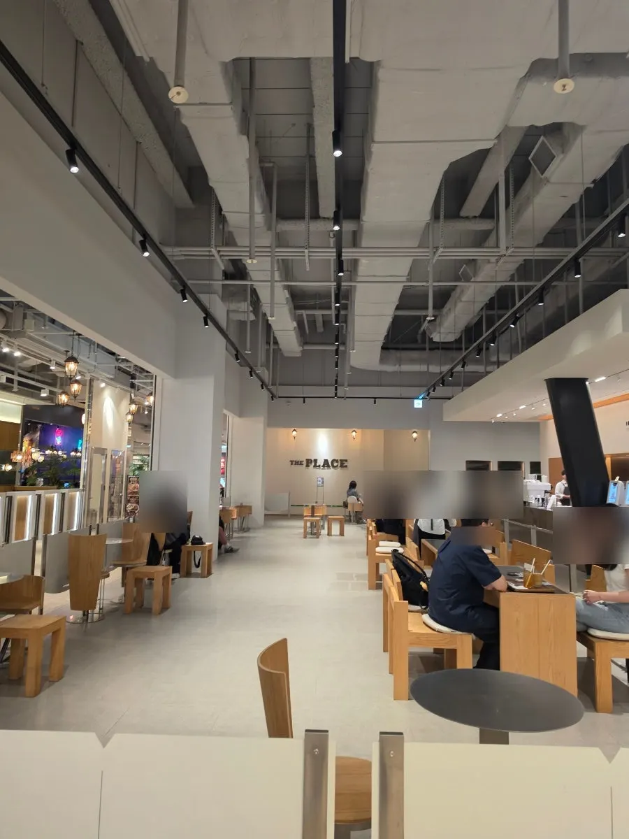 Café seating with wood tables and wooden chairs