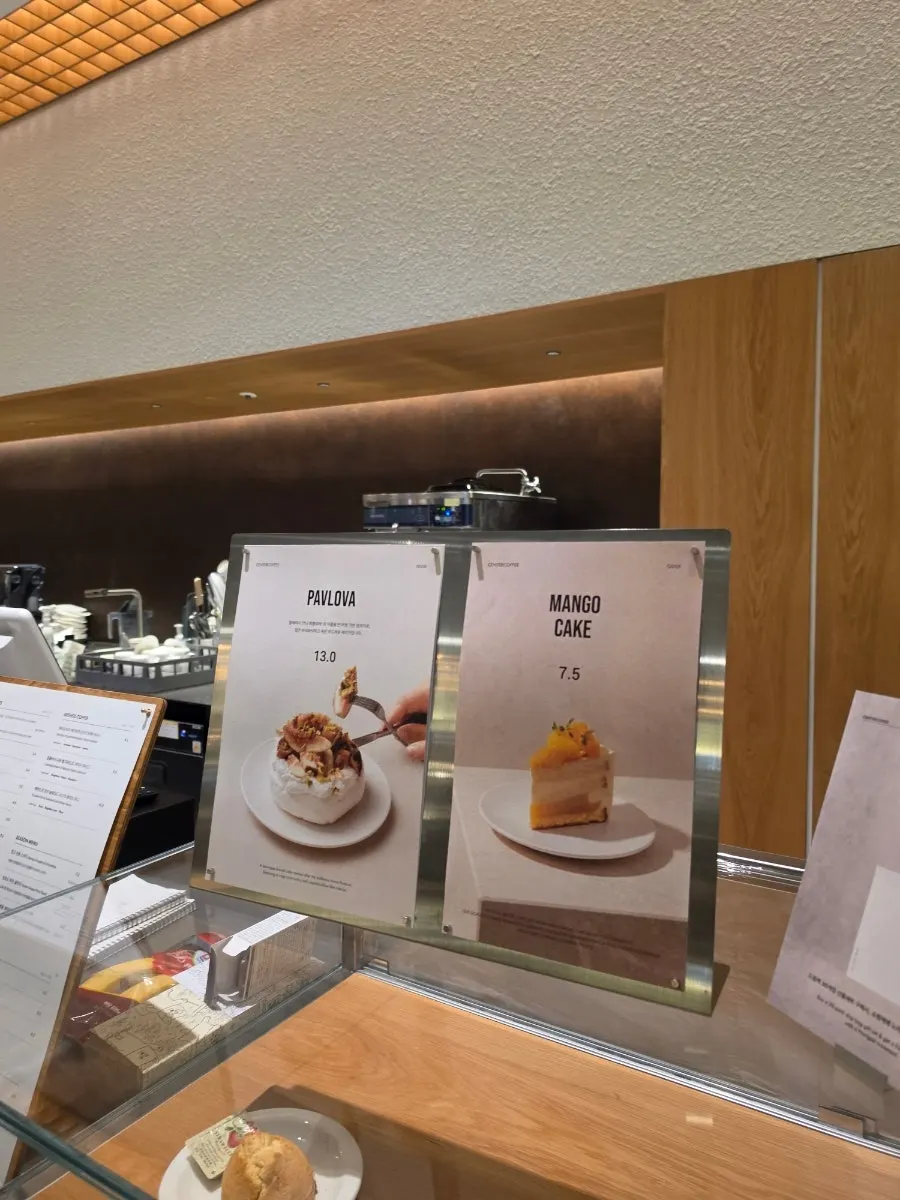 Dessert case displaying tiramisu and cheesecake