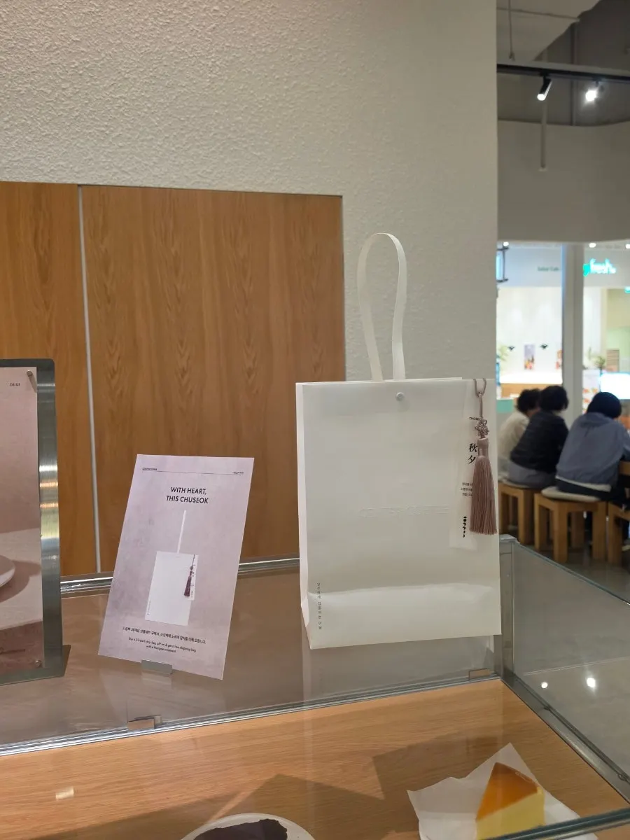 Display of mango cake, pavlova, and other desserts