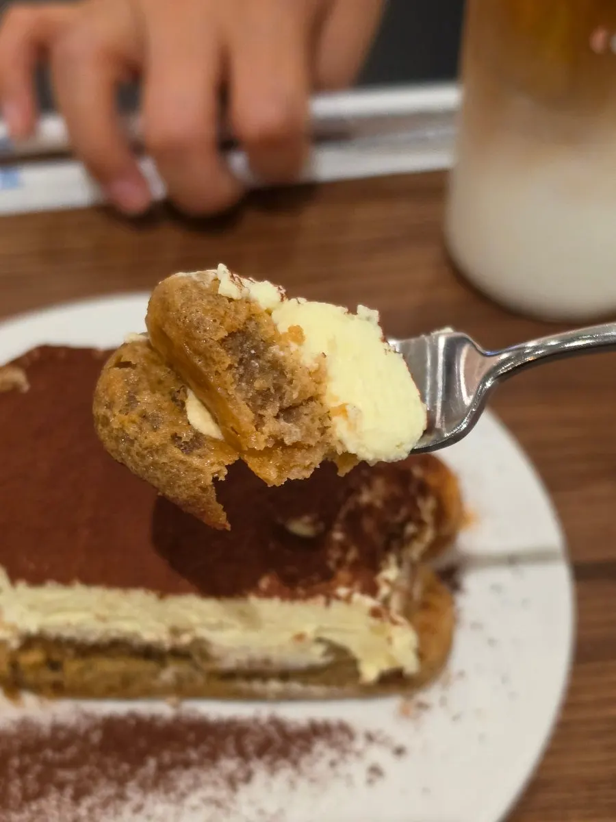 Close-up of tiramisu showing the mascarpone cream