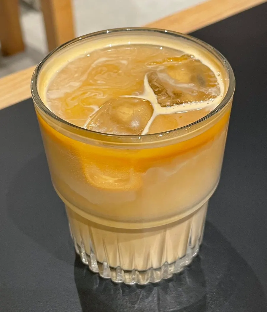 A glass of Center Coffee's iced flat white