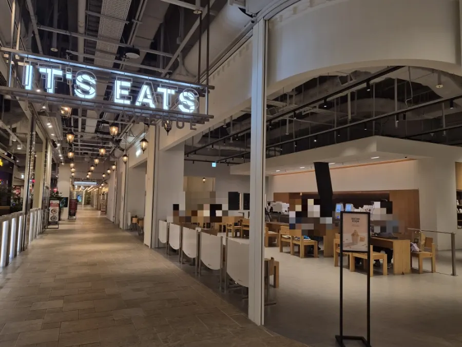 Wide entrance to Center Coffee in front of the central escalator