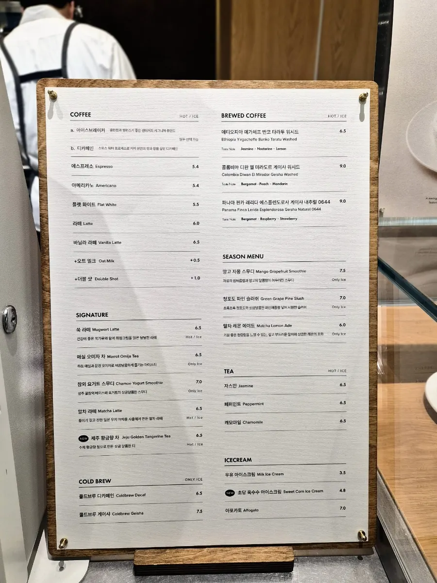 Menu board of drinks and desserts at Center Coffee