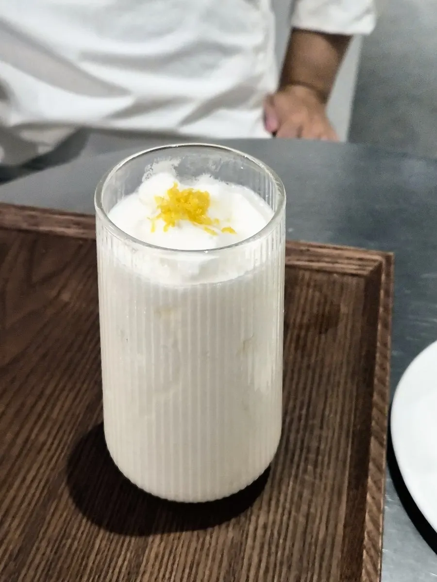 Close-up of the melon yogurt smoothie topped with lemon zest