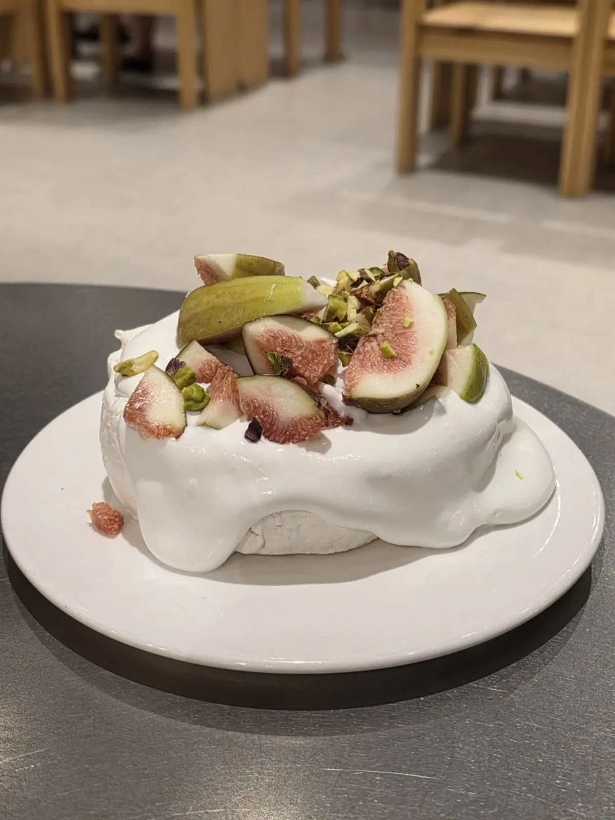 Fig pavlova dessert piled high with figs