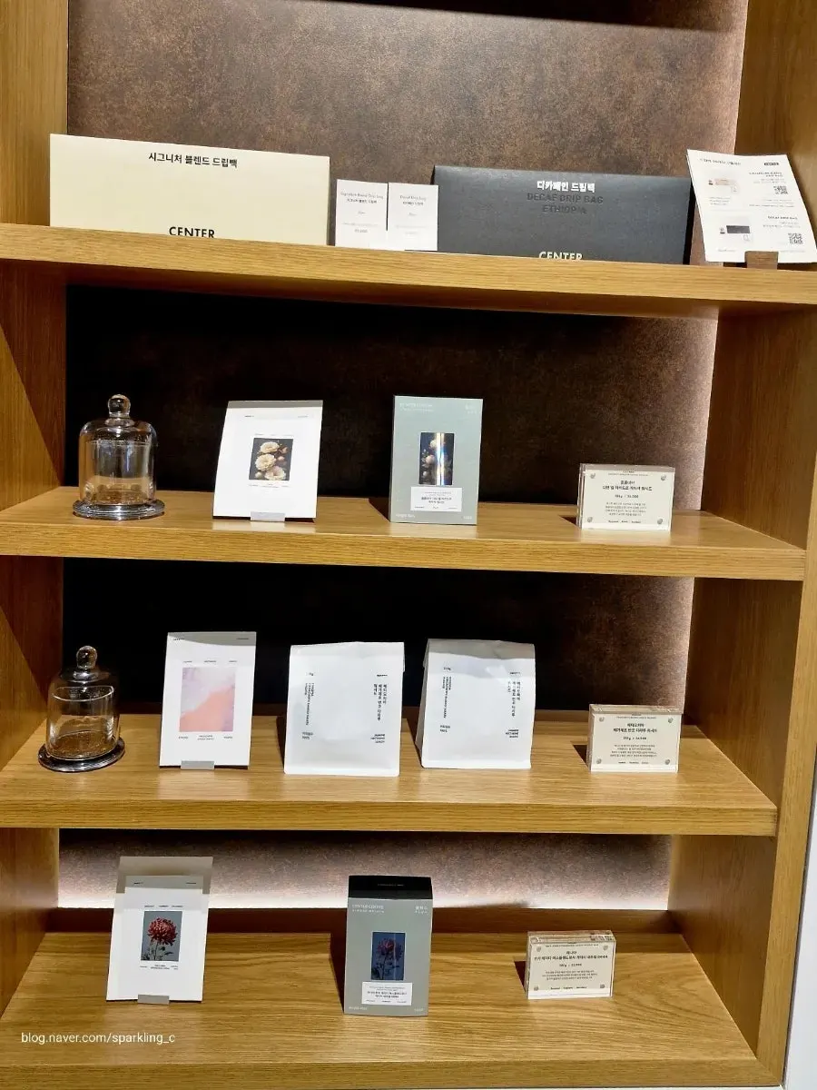 Product display shelf of Center Coffee items in a corner of the café