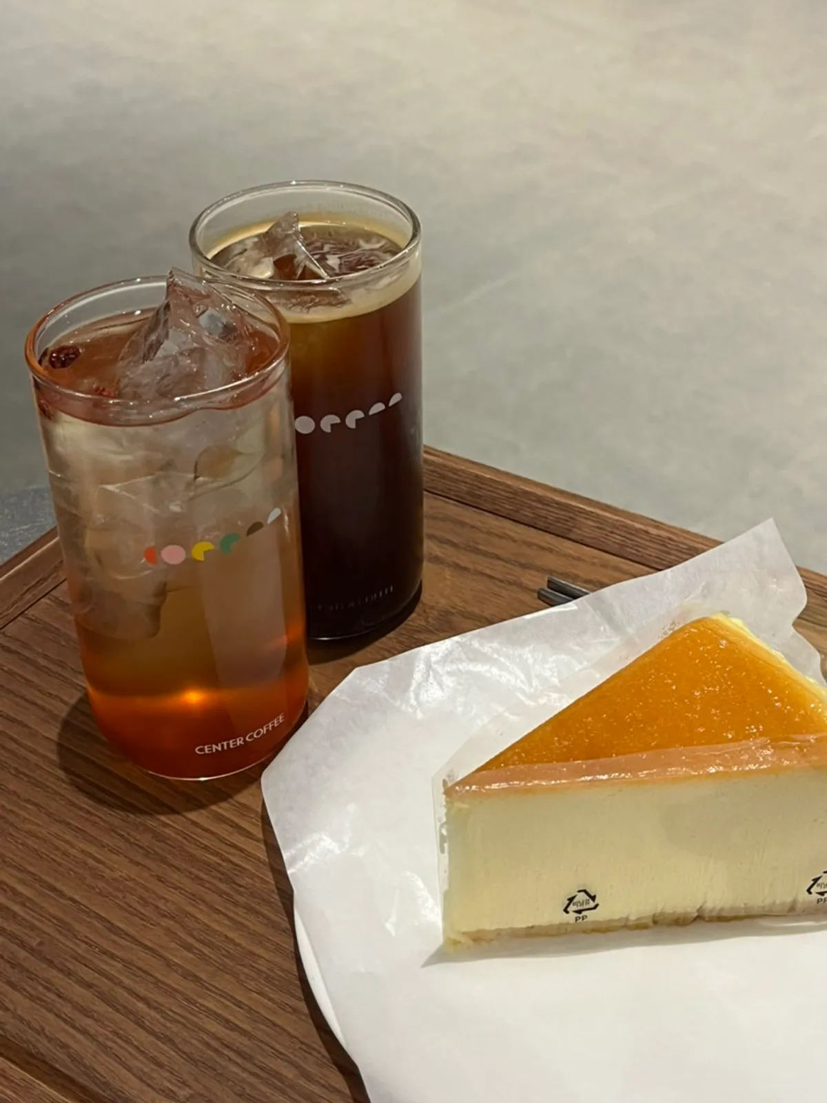 Iced Americano, plum omija tea, and Chicago cheesecake set together
