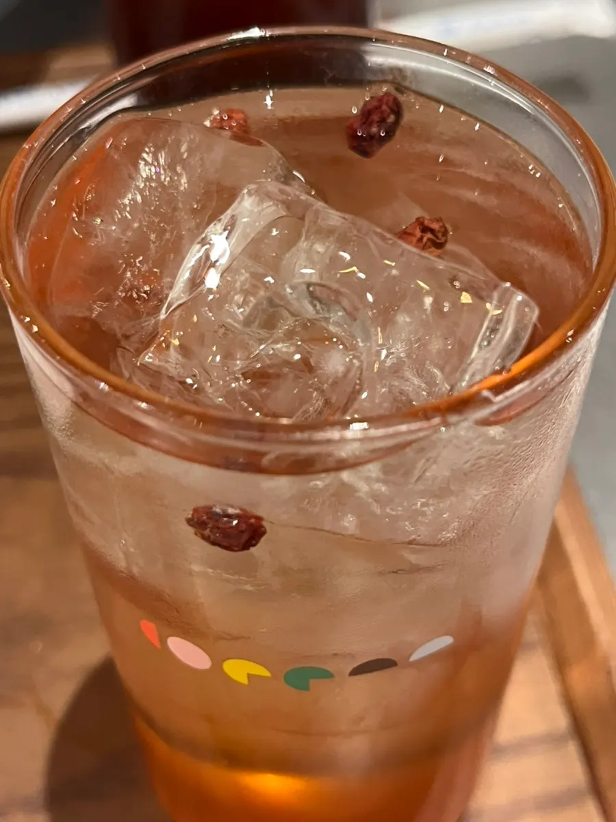 Plum omija tea served in a glass