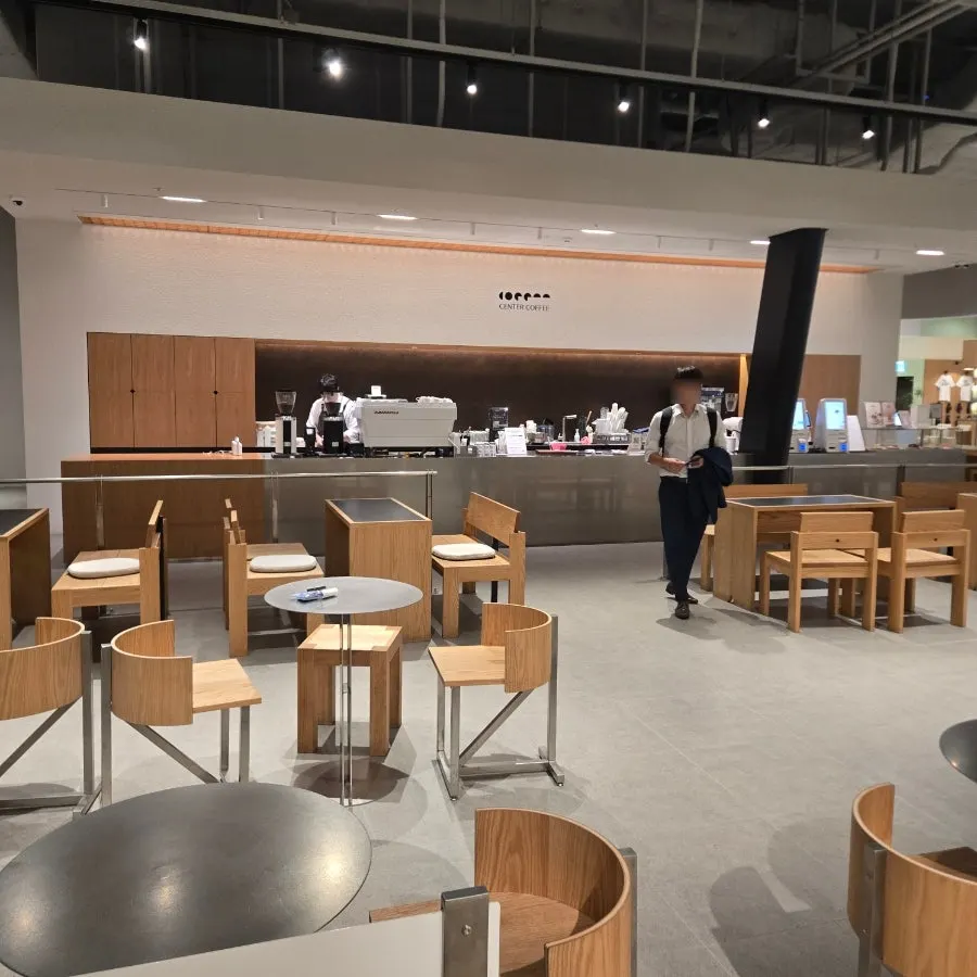 High-ceilinged, open interior of Center Coffee Guui East Pole