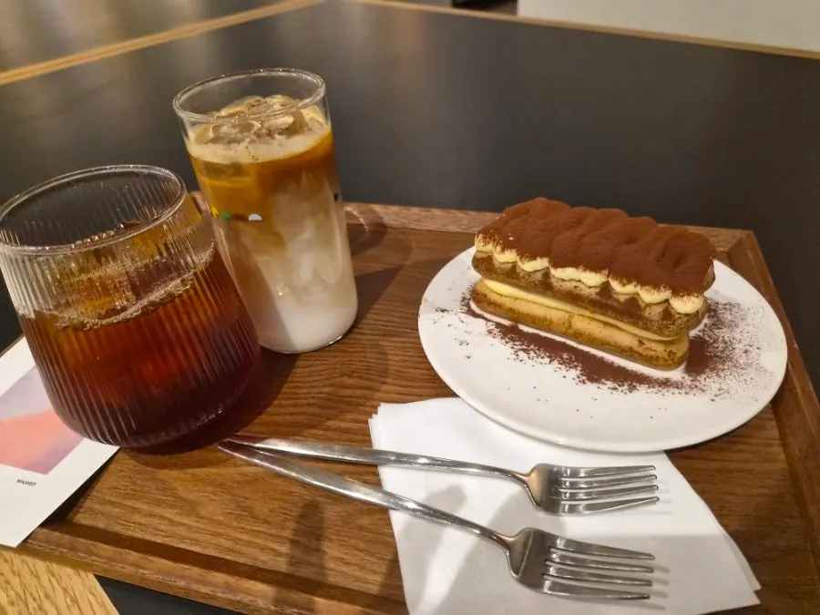 Ethiopia brewing coffee, decaf caffe latte, and tiramisu