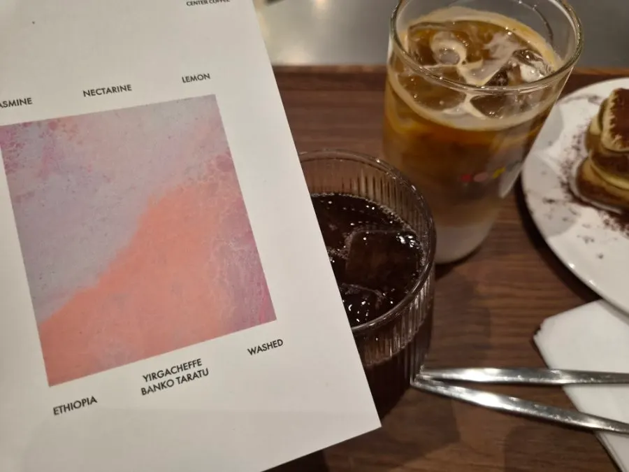 Tiramisu placed together with coffee on the table