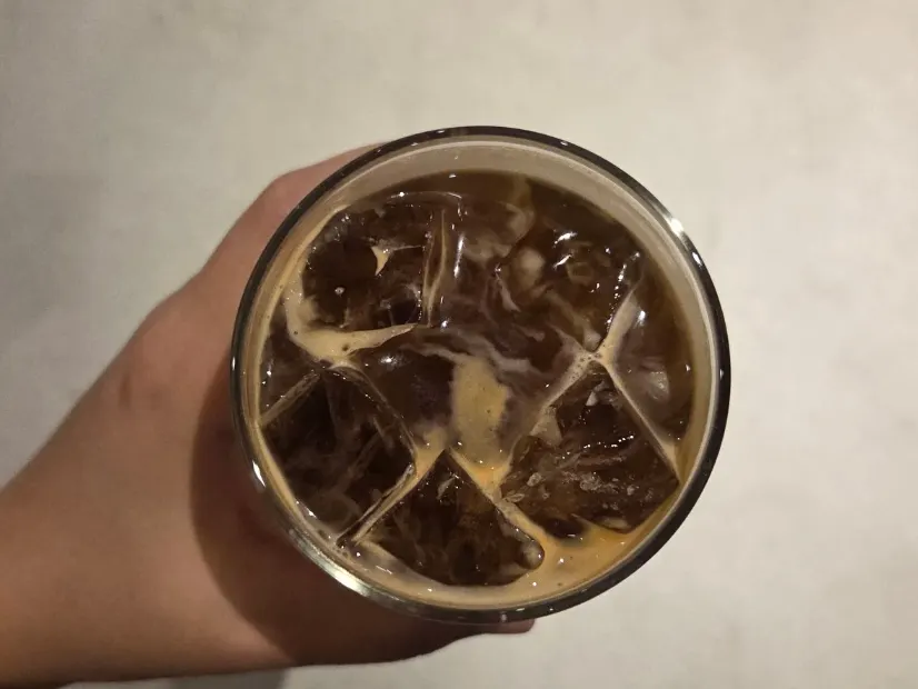 Close-up of iced americano with crema on top