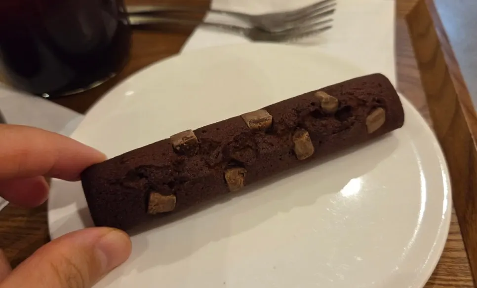Plate with the long dark choco bar financier