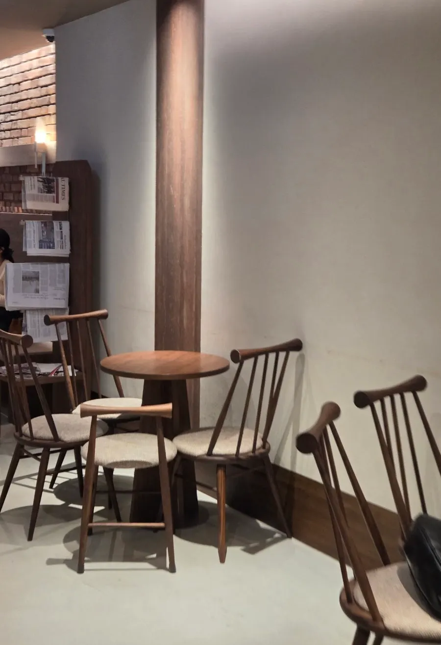 Row of group tables further inside the café
