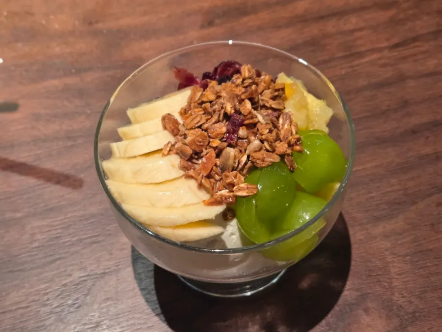 Greek yogurt bowl topped with fruit and granola