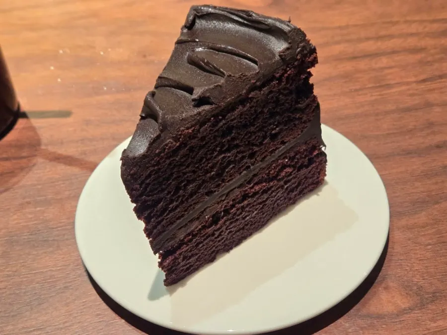 Slice of Matilda cake filled with chocolate ganache