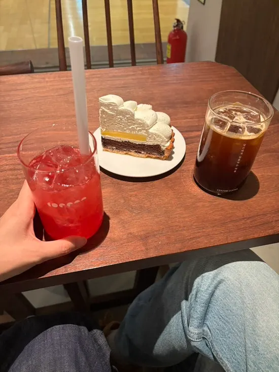 Coffee and dessert seen from side-by-side seating