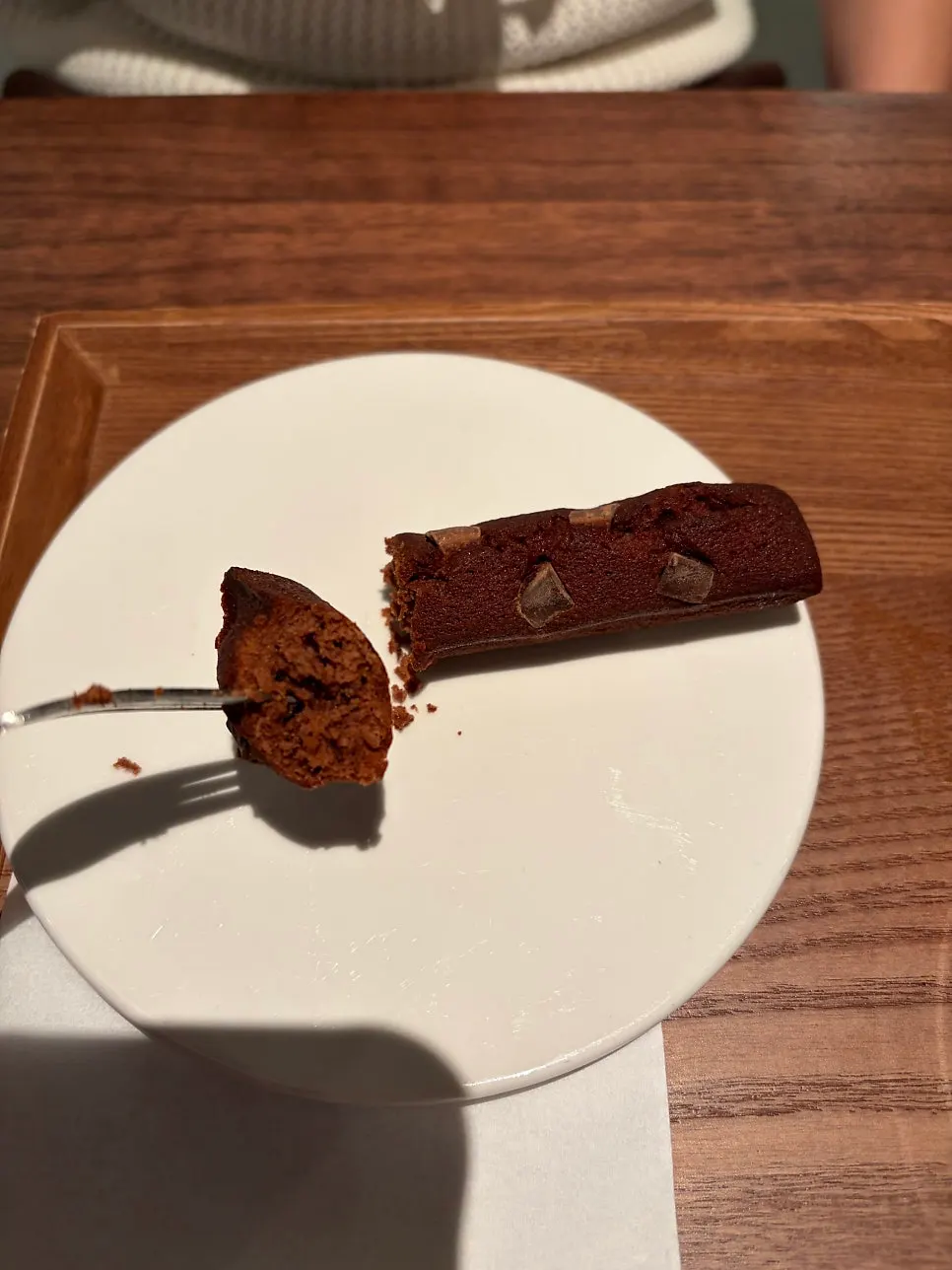 Cross-section of the dark chocolate baton financier eaten with coffee