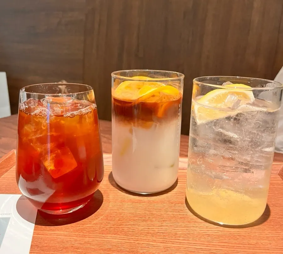 Three drinks: Panama Geisha, Orange Bianco, and Pear Lemon Ade