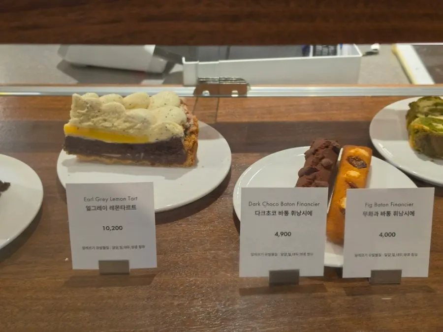 Cakes and financiers displayed in the dessert case