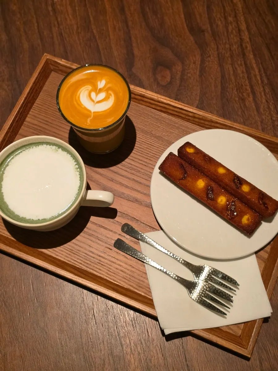 Flat white and mugwort latte on the table