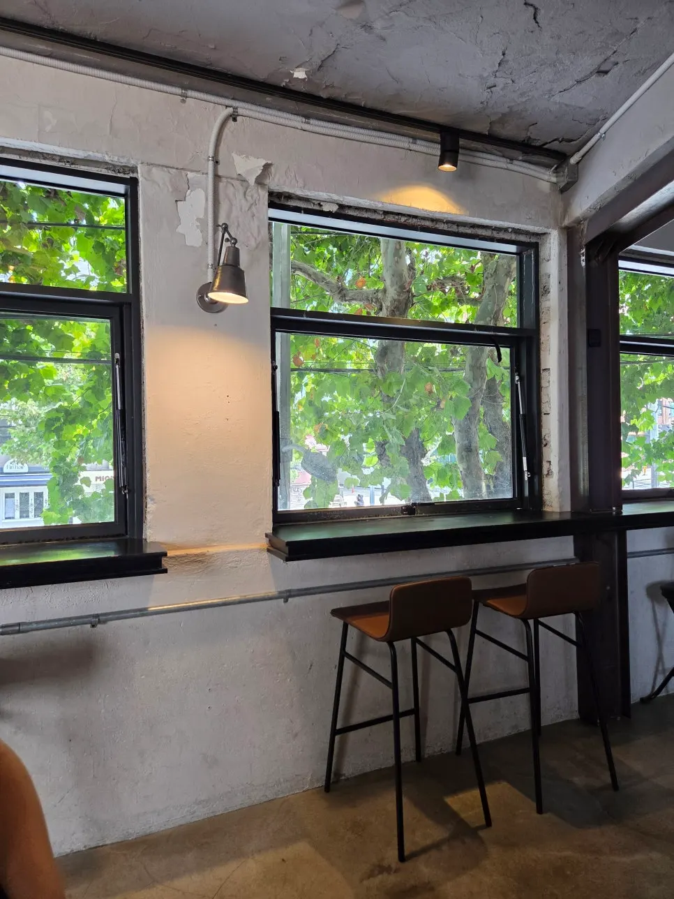 2nd-floor window seating with windows opened wide