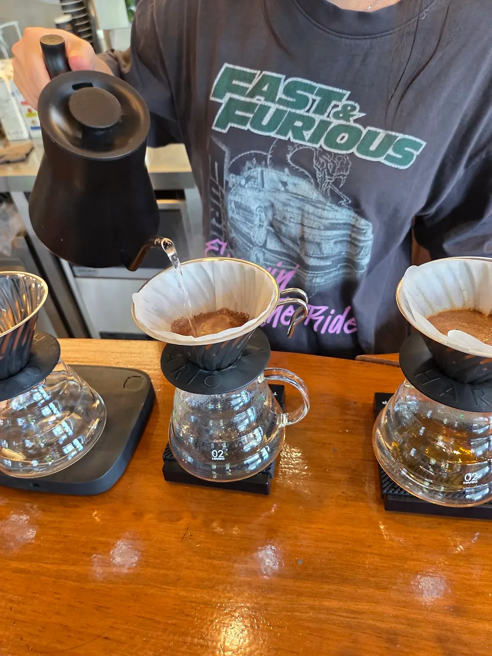 Staff brewing coffee at the bar